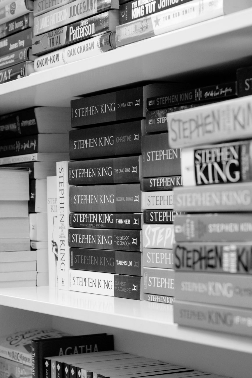 stacks of books on a bookshelf